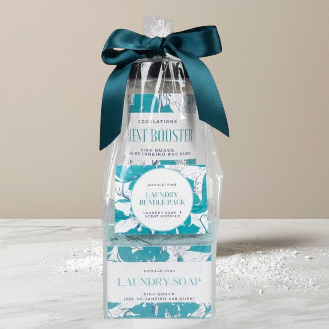Doodlations Coffee Bar & Boutique laundry bundle pack with pink guava scented laundry soap and scent booster, packaged in a clear bag with a teal ribbon.