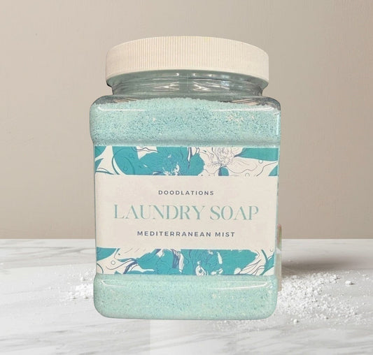 Mediterranean Mist scent, light-blue granules in a clear plastic jar with a white lid.