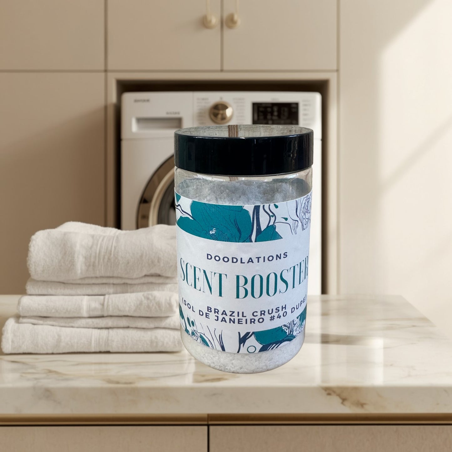 Doodlations Laundry Scent Booster in Brazilian Crush scent, a clear jar filled with white granules, featuring a label with teal floral designs and text.