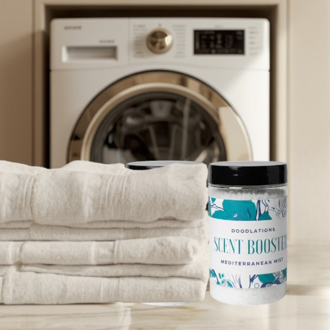 Doodlations Laundry Scent Booster in Mediterranean Mist, a clear jar filled with white granules and a label featuring floral designs and text.