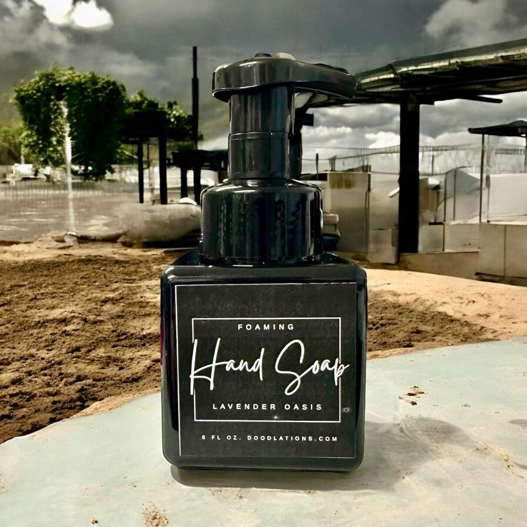 Doodlations Lavender Oasis foaming hand soap in a black square bottle with a white label. 8 fl oz.