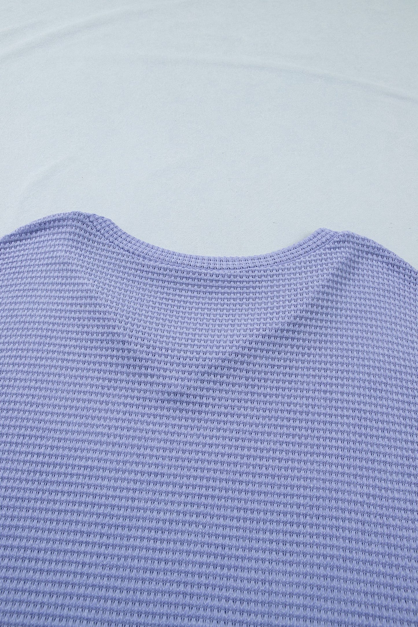 Doodlations Coffee Bar & Boutique lavender waffle knit V-neck top with cuffed short sleeves.