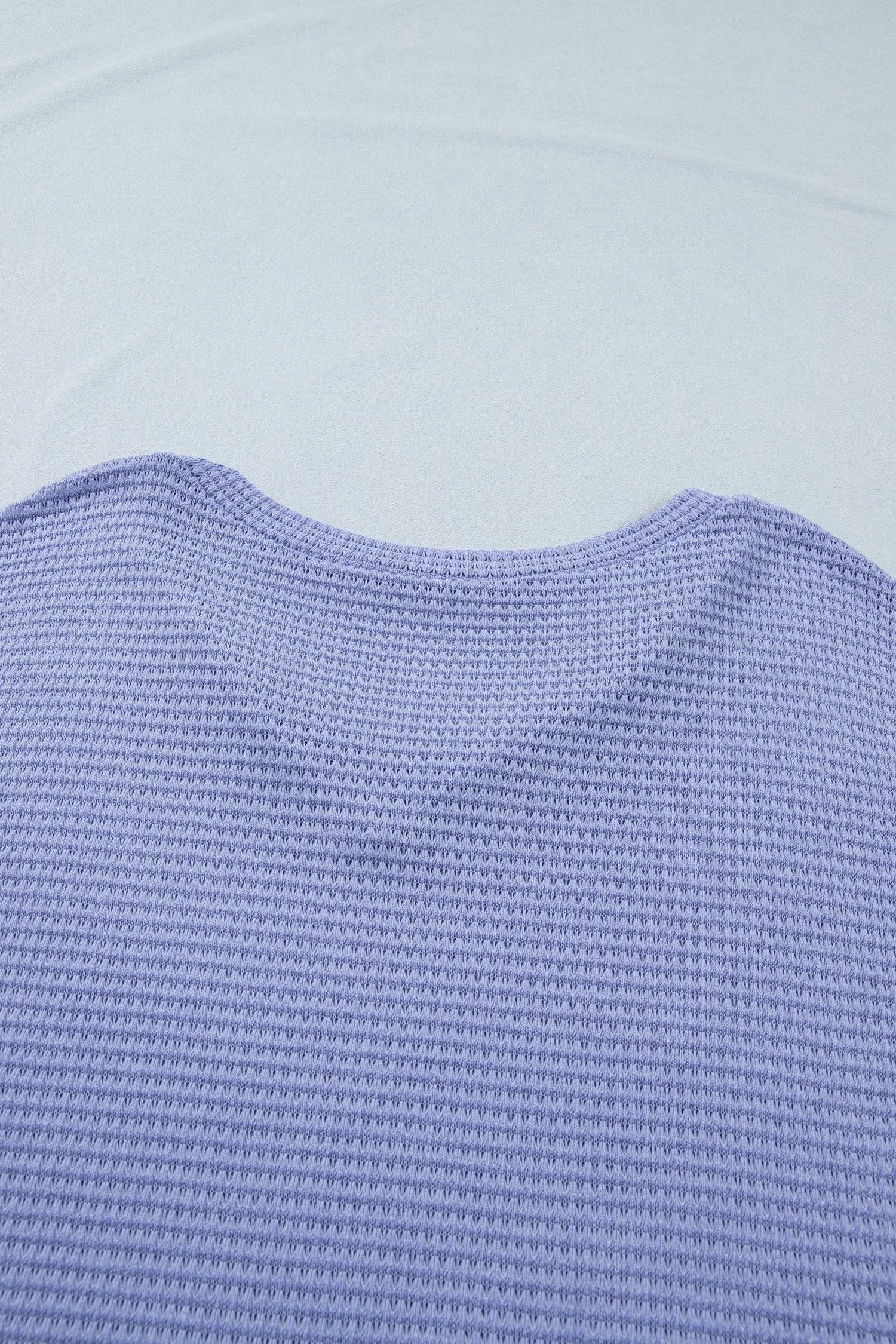 Doodlations Coffee Bar & Boutique lavender waffle knit V-neck top with cuffed short sleeves.