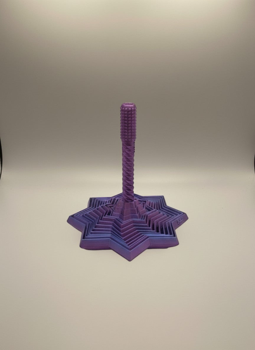 Doodlations Coffee Bar & Boutique layered star fidget toy in purple and pink, with rotating interlocking segments for stress relief.