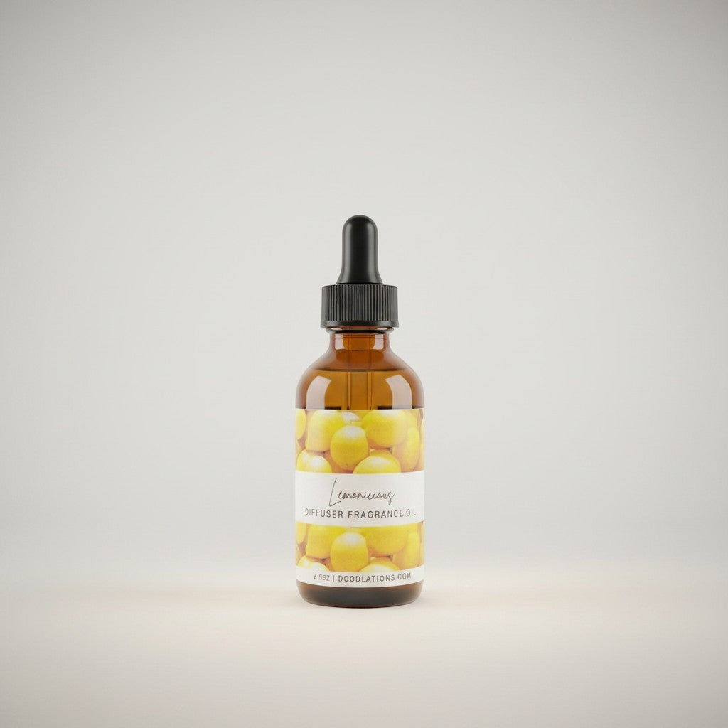 Doodlations Coffee Bar & Boutique amber glass bottle of Lemonicious diffuser fragrance oil with dropper top, featuring a label with lemons.