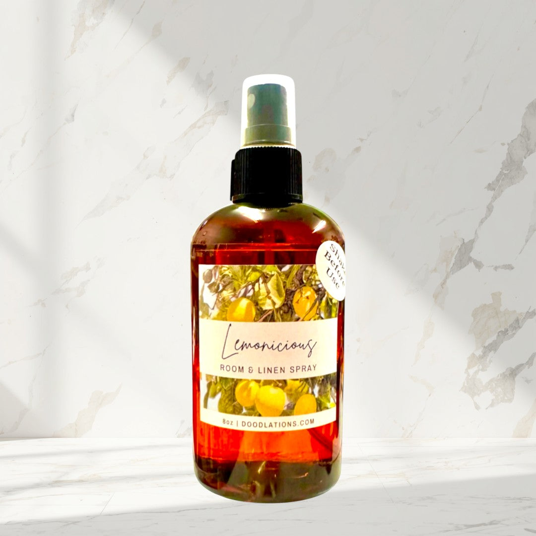 Doodlations Lemonicious room and linen spray in amber bottle with citrus design. 8oz.