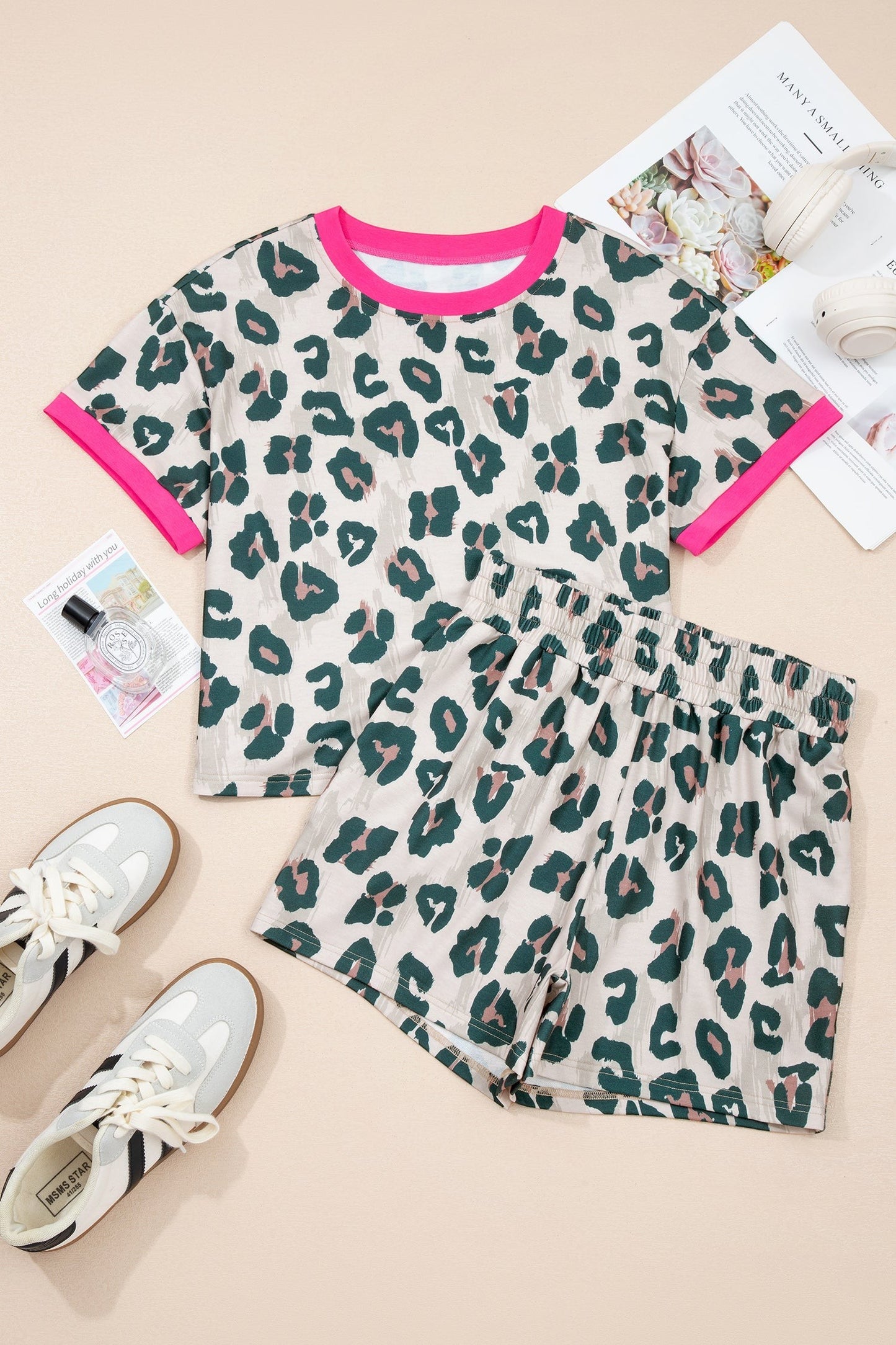 Doodlations Coffee Bar & Boutique The Leslie leopard print two-piece short set with pink trim. Relaxed fit top and shorts.