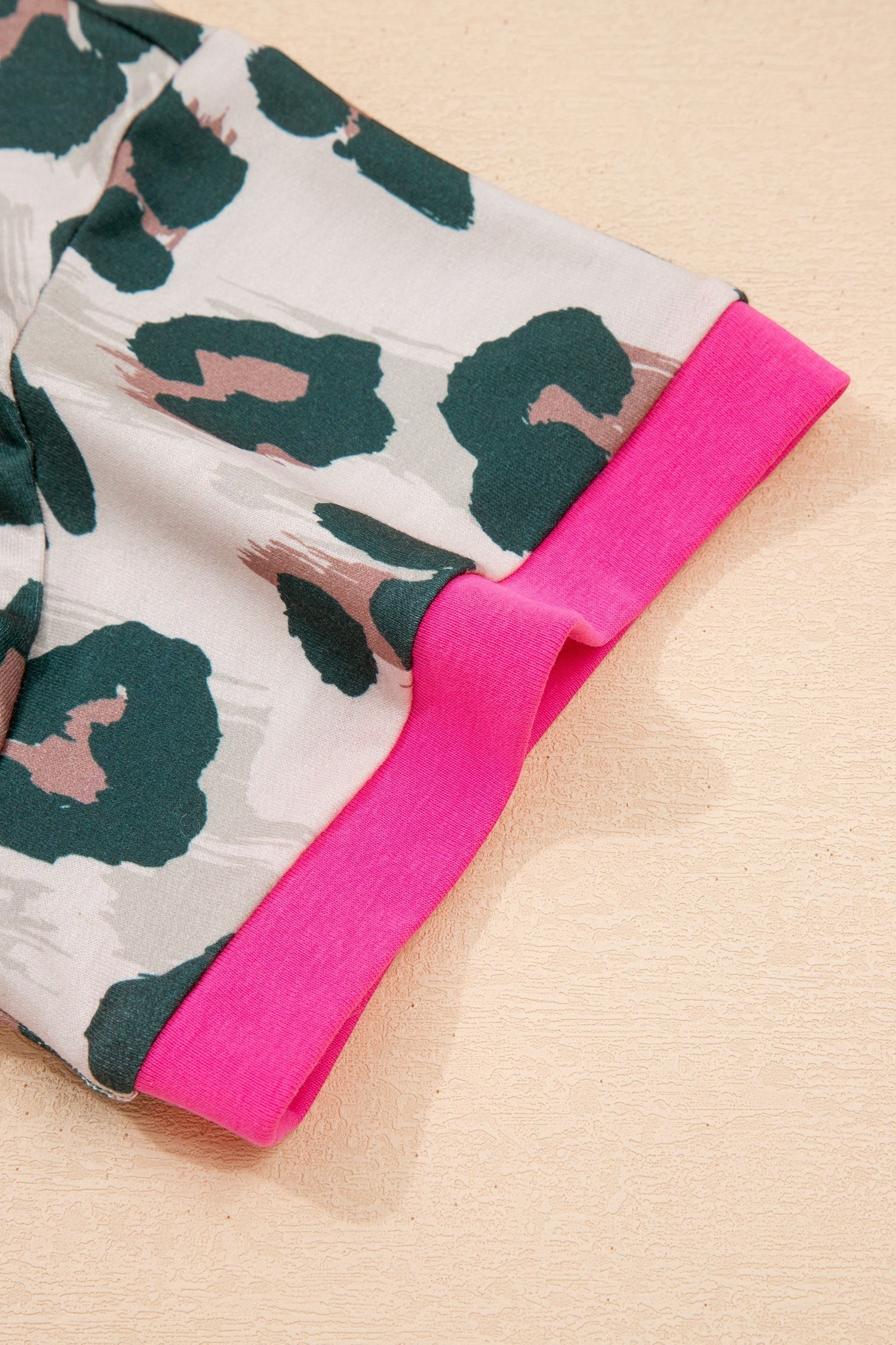 Doodlations Coffee Bar & Boutique The Leslie leopard print two-piece short set with pink trim.