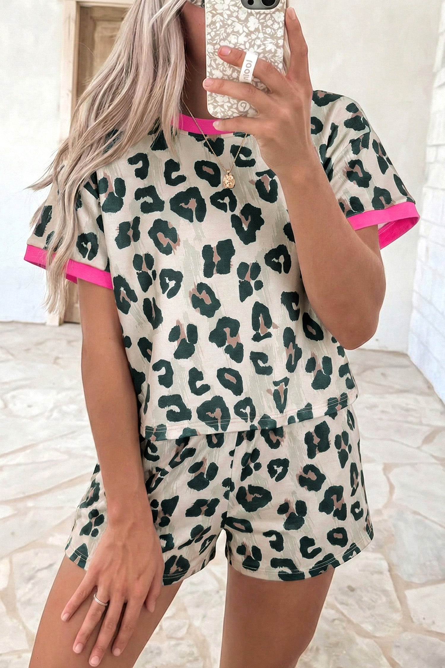 Doodlations Coffee Bar & Boutique The Leslie leopard print two-piece short set with pink trim.