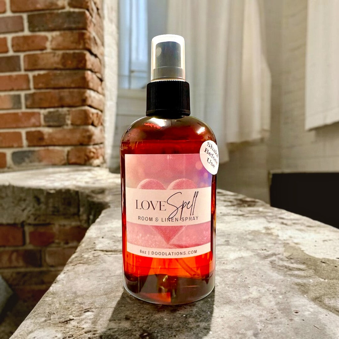 Doodlations Love Spell Room & Linen Spray, 8oz amber glass bottle with spray top. Fruity floral scent.