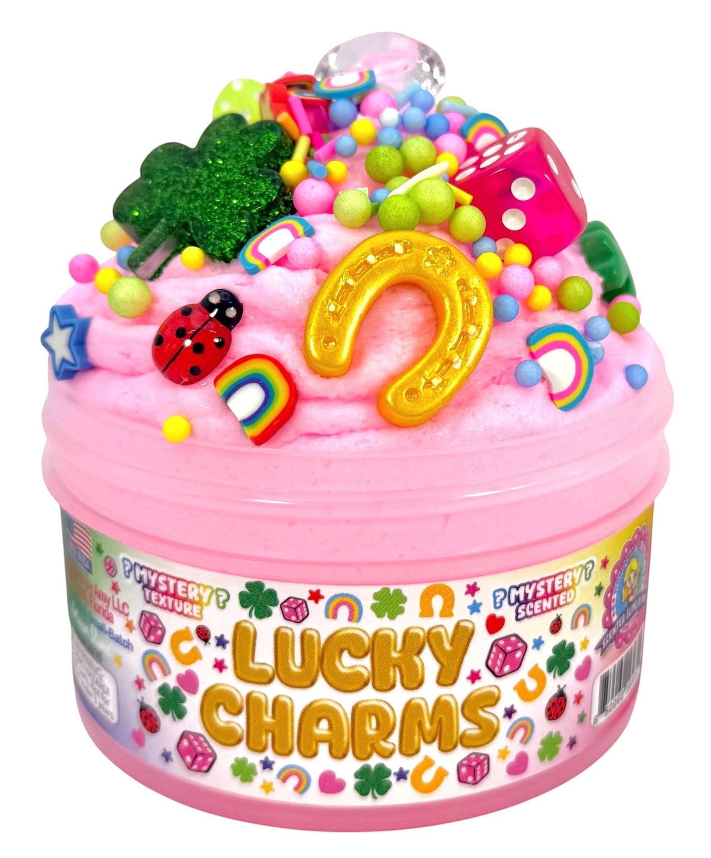 Doodlations Coffee Bar & Boutique Lucky Charms pink mystery slime topped with gold horseshoe, green shamrock, dice, ladybugs, and rainbows.