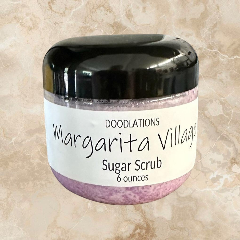 Doodlations Margarita Village sugar scrub in a clear jar with a black lid, 6 oz, light purple scrub.