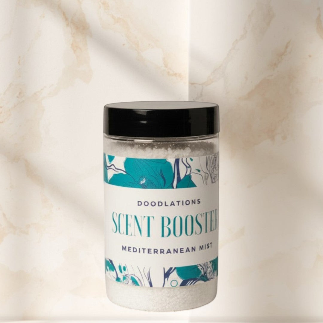 Doodlations Mediterranean Mist Scent Booster laundry additive in a clear plastic jar with a black lid. White granules inside.