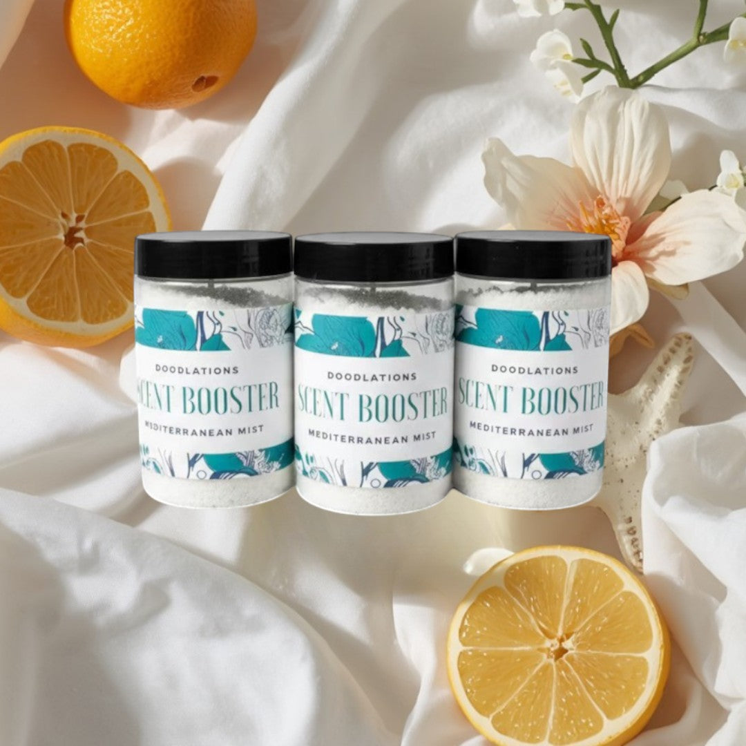 Three clear plastic jars of Doodlations Mediterranean Mist Scent Booster with white granular contents and teal floral labels.