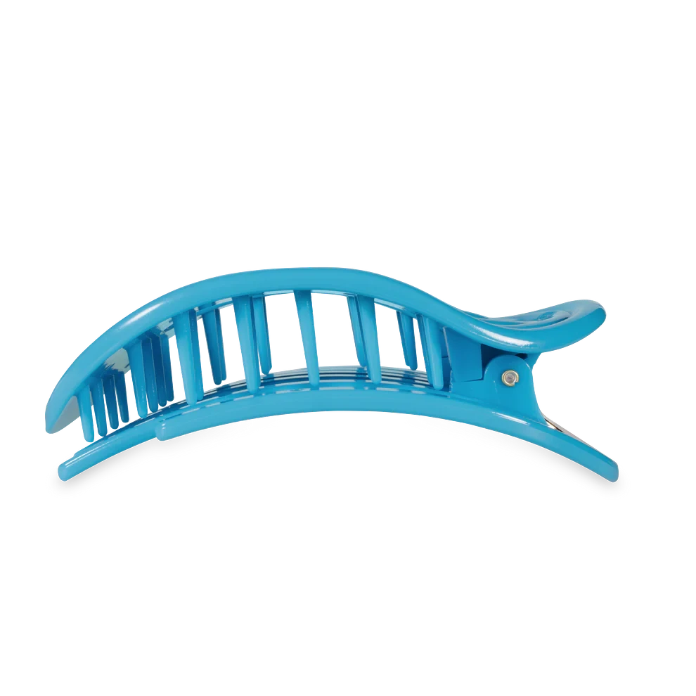 Doodlations Coffee Bar & Boutique Miami Vice blue flat round hair clip for updos and styling.