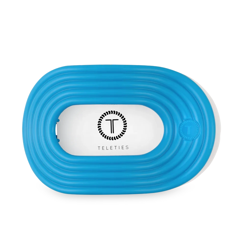 Doodlations Coffee Bar & Boutique Miami Vice blue flat round hair clip with no-slip grip.