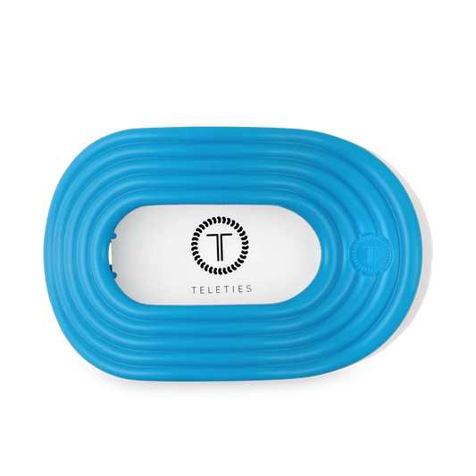 Doodlations Coffee Bar & Boutique Miami Vice blue flat round hair clip with no-slip grip.