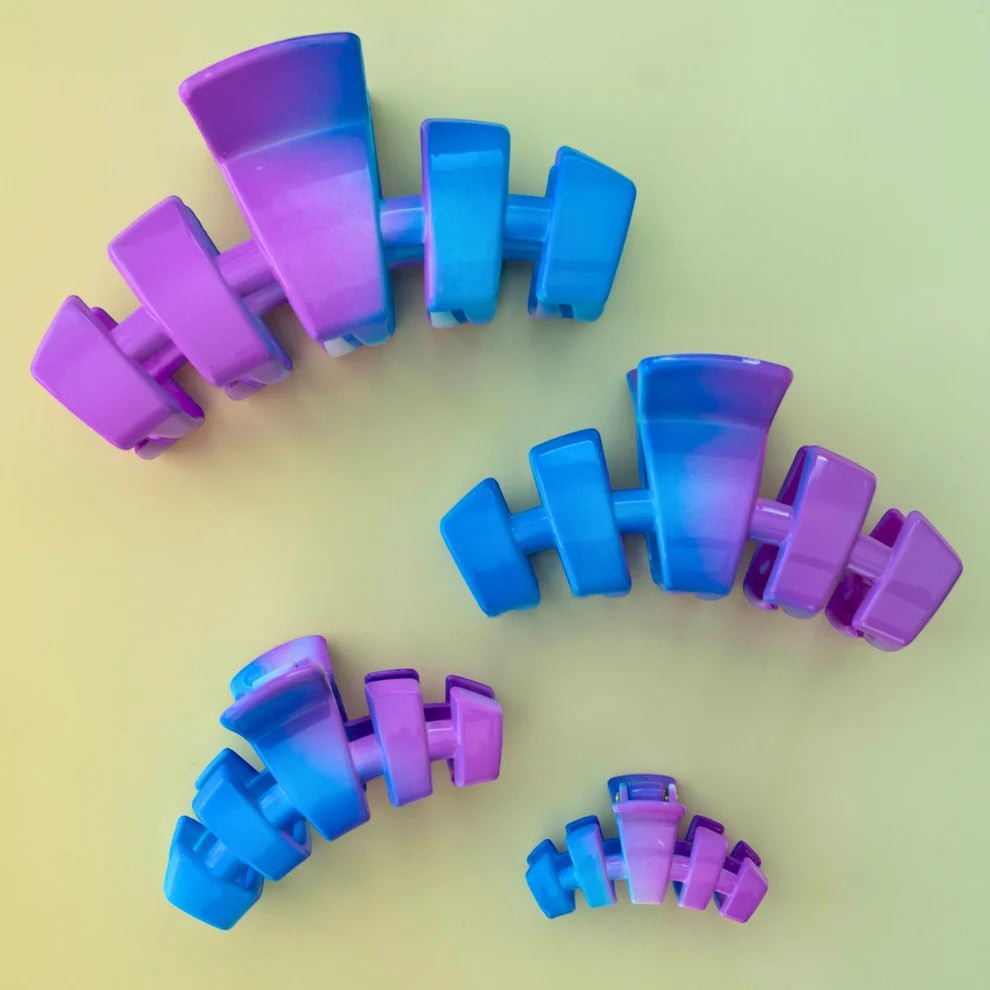 Doodlations Coffee Bar & Boutique Miami Vice claw clip in blue and purple gradient, flexible material, fishbone design.