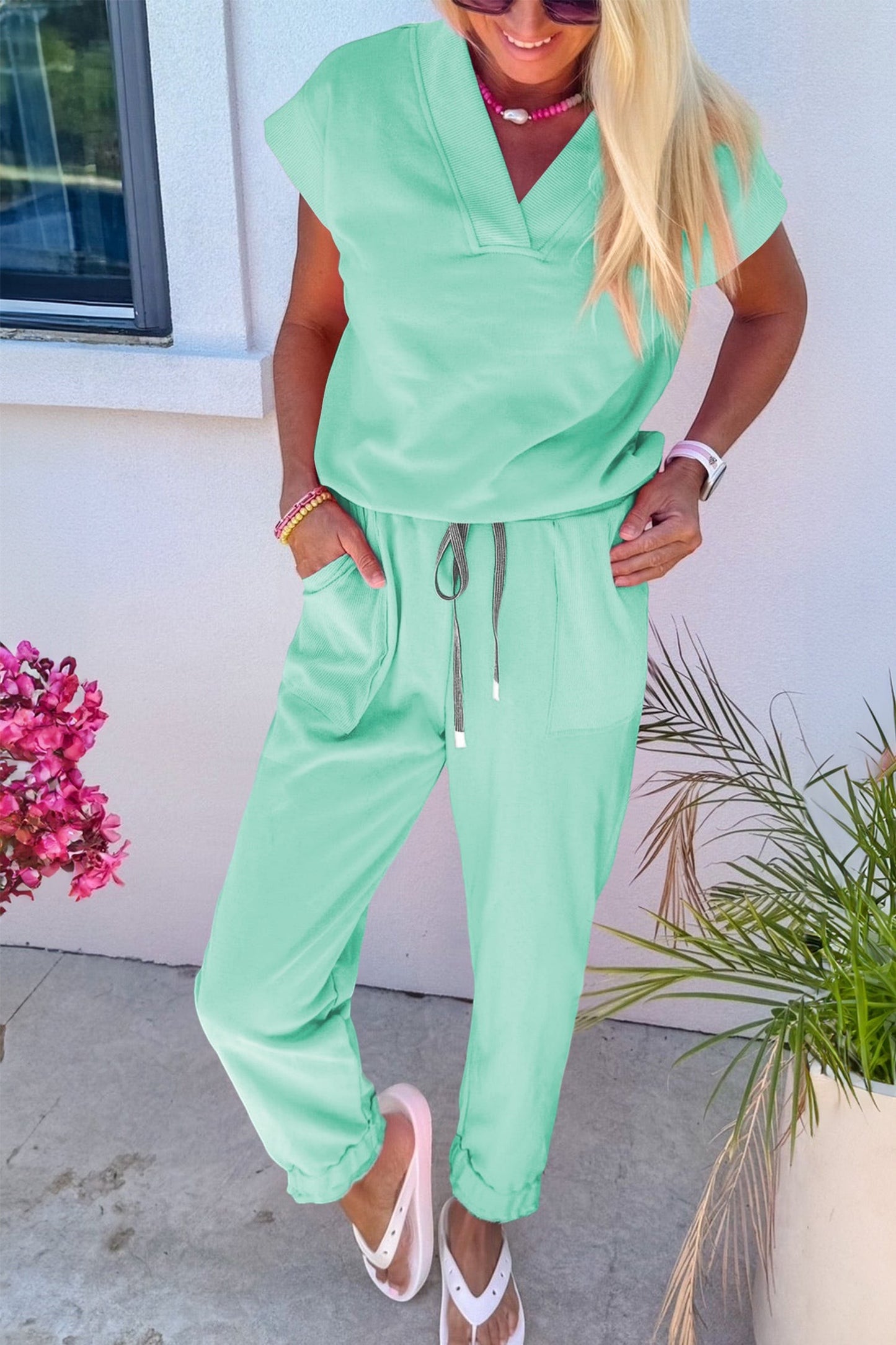 Doodlations Coffee Bar & Boutique mint green V-neck short sleeve lounge set with drawstring pants and pockets.