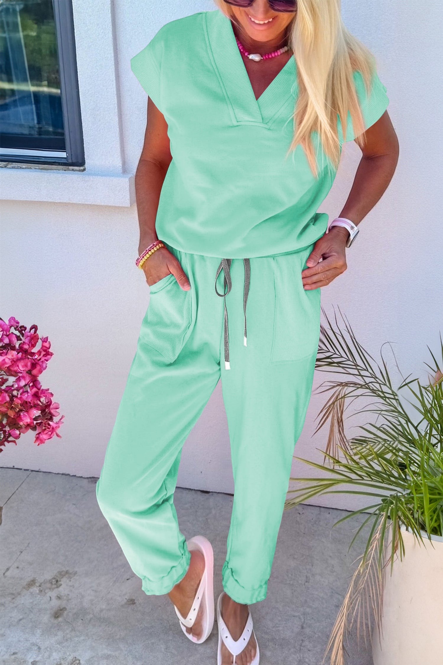 Doodlations Coffee Bar & Boutique mint green V-neck short sleeve lounge set with drawstring pants and pockets.
