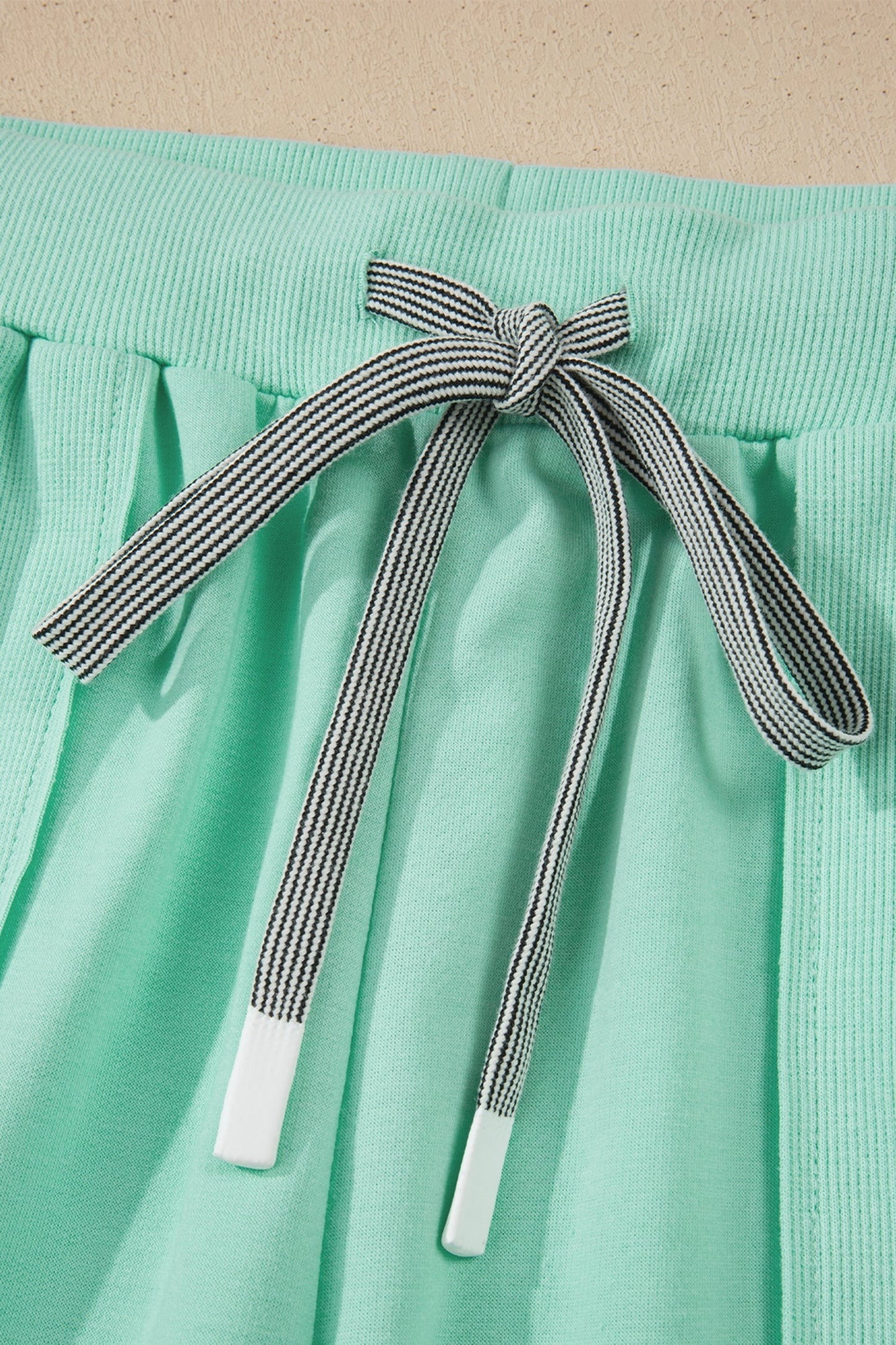 Doodlations Coffee Bar & Boutique mint green lounge set with drawstring and elastic waistband.