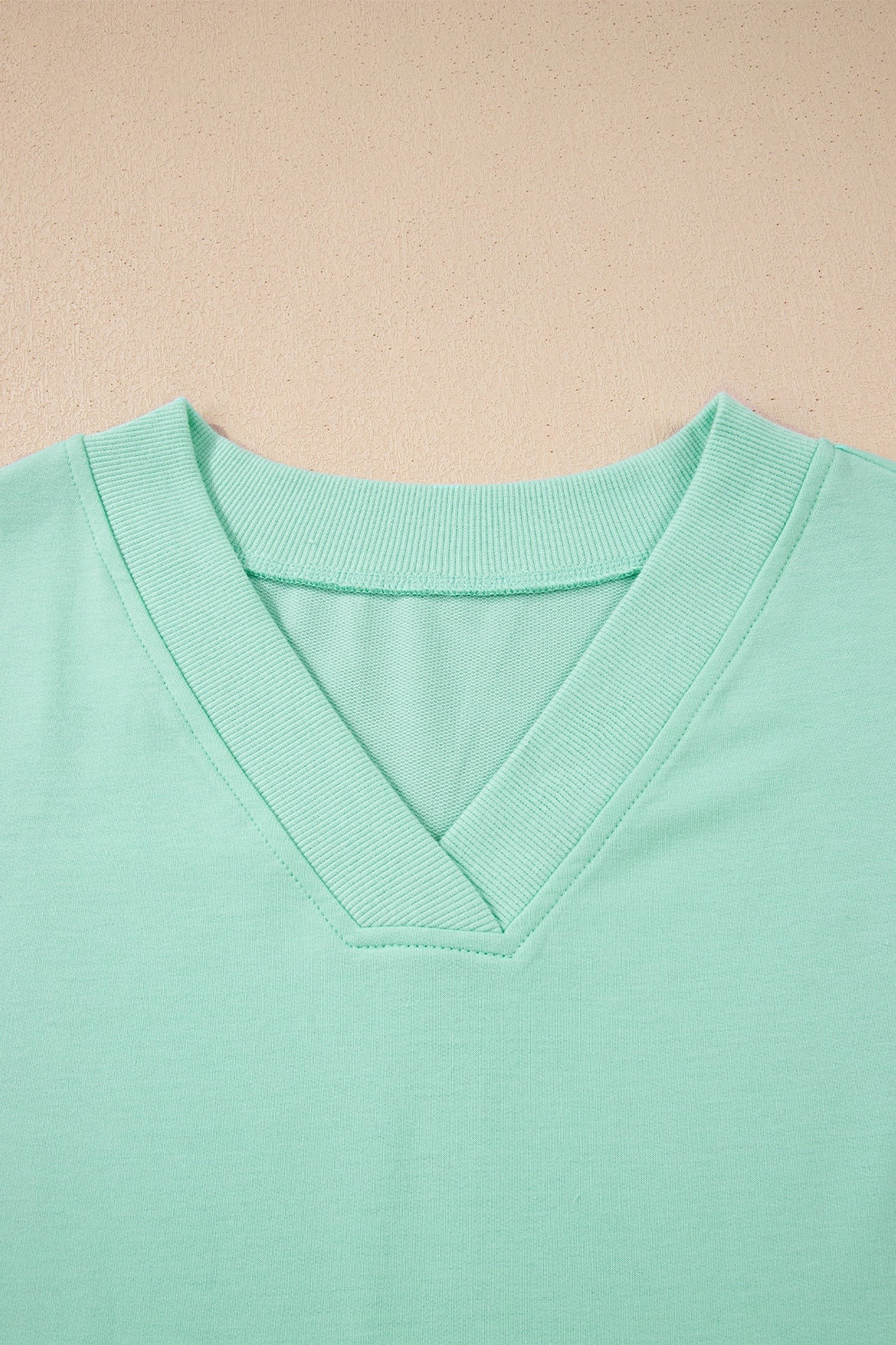 Doodlations Coffee Bar & Boutique mint green V-neck lounge set, soft breathable fabric, relaxed fit top with short sleeves and drawstring pants.