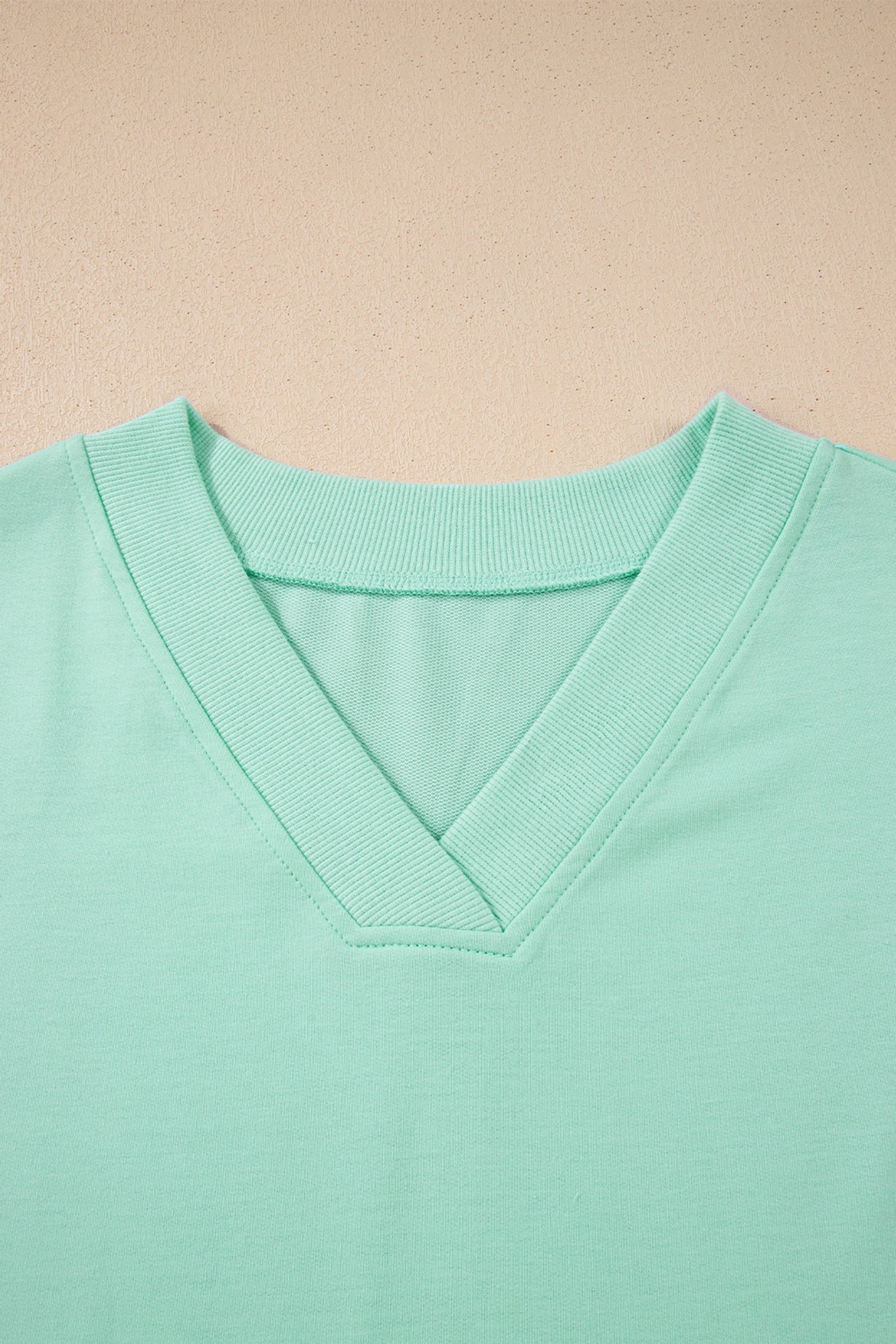 Doodlations Coffee Bar & Boutique mint green V-neck lounge set, soft breathable fabric, relaxed fit top with short sleeves and drawstring pants.