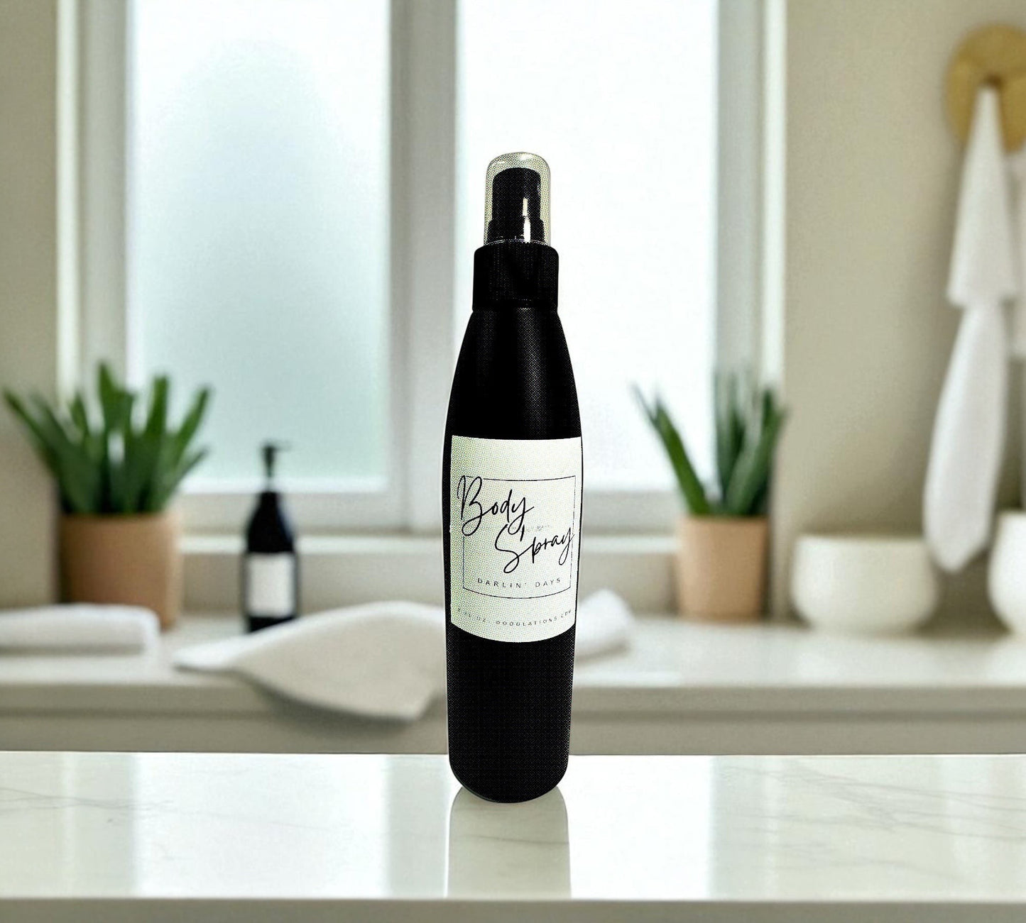 Doodlations Moisturizing Body Spray in a black bottle with a white label, featuring aloe and hydrating butters and oils for everyday use.