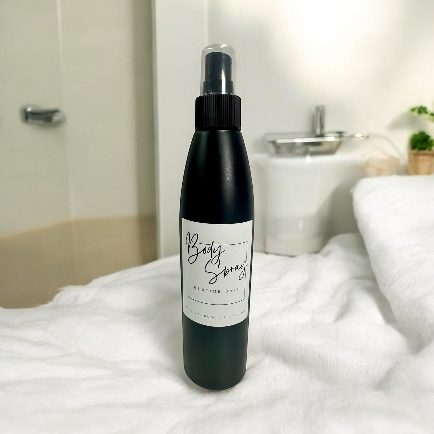 Doodlations Moisturizing Body Spray in a black bottle with a white label that says "Body Spray BEDTIME BATH".