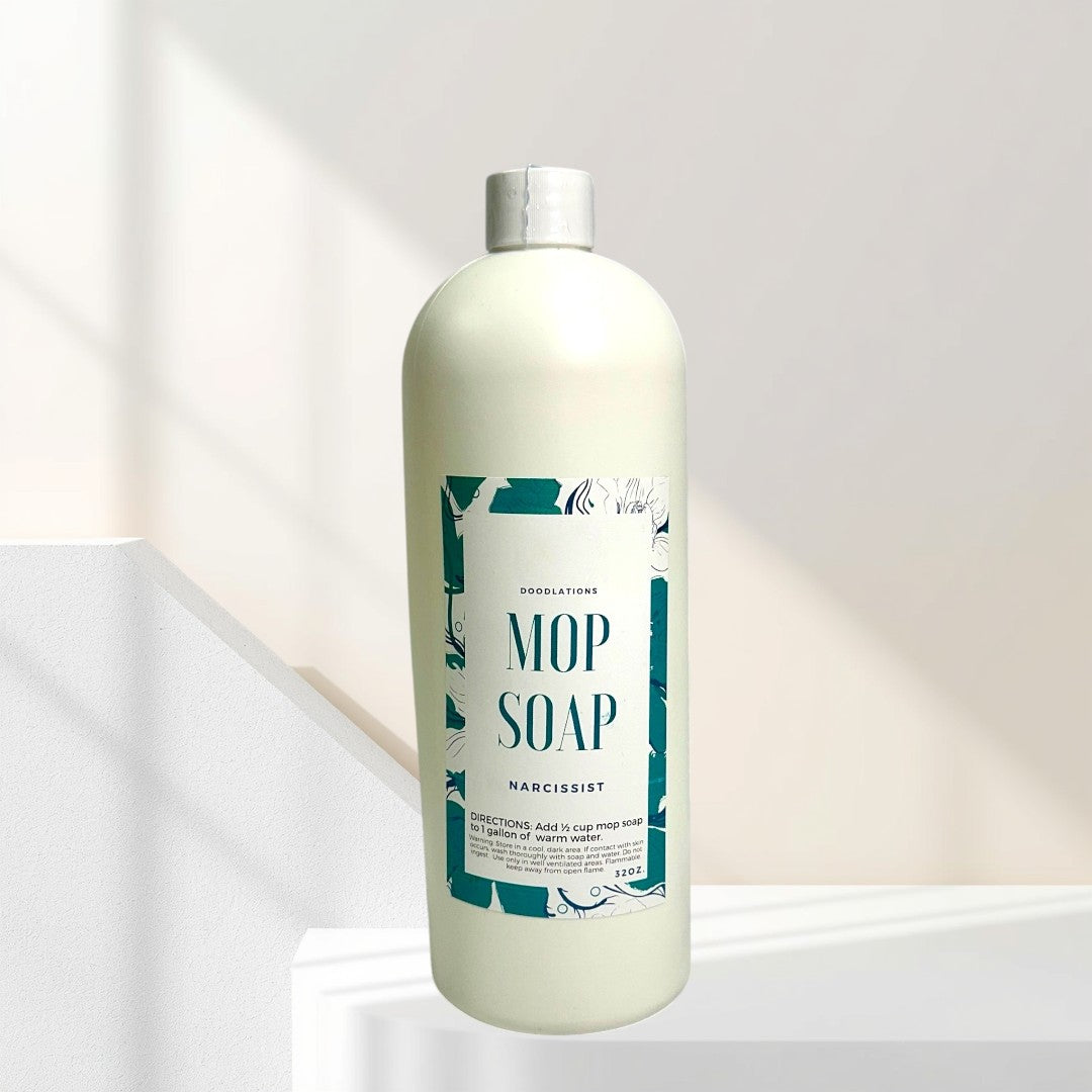 Doodlations Concentrated Mop Soap in The Narcissist scent, a peach and raspberry floral blend, 32 oz bottle.