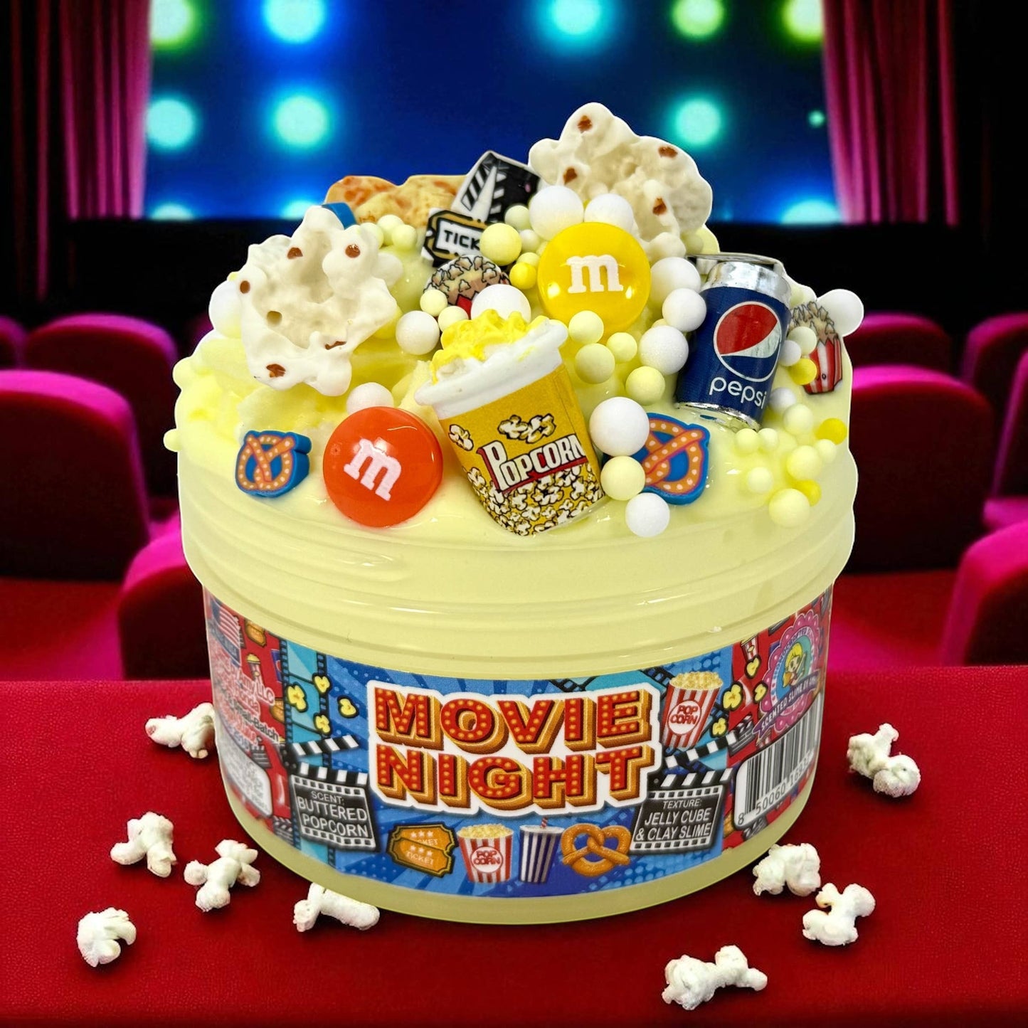 Doodlations Movie Night jelly cube clay slime with popcorn, M&Ms, Pepsi can, and movie ticket charms.