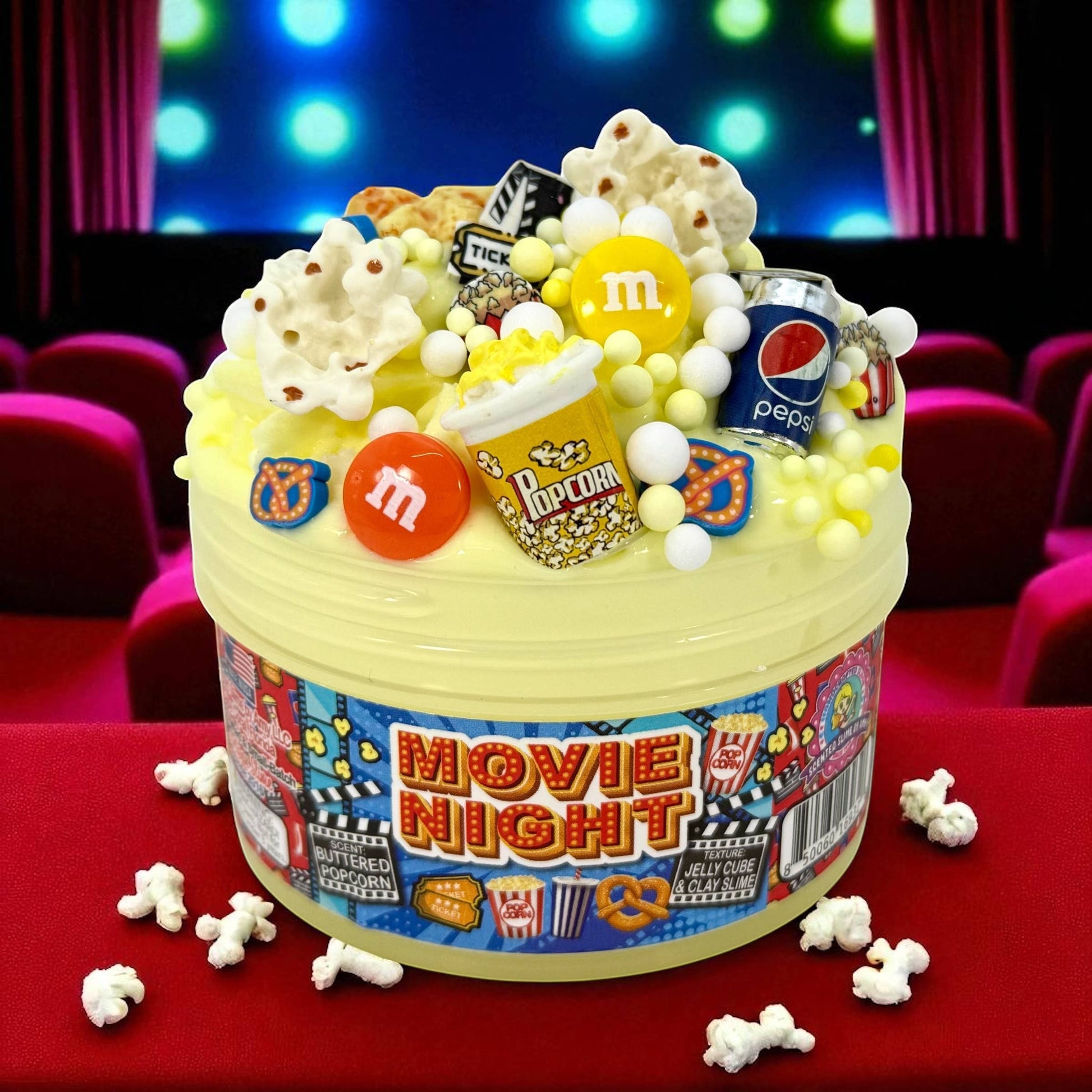 Doodlations Movie Night jelly cube clay slime with popcorn, M&Ms, Pepsi can, and movie ticket charms.