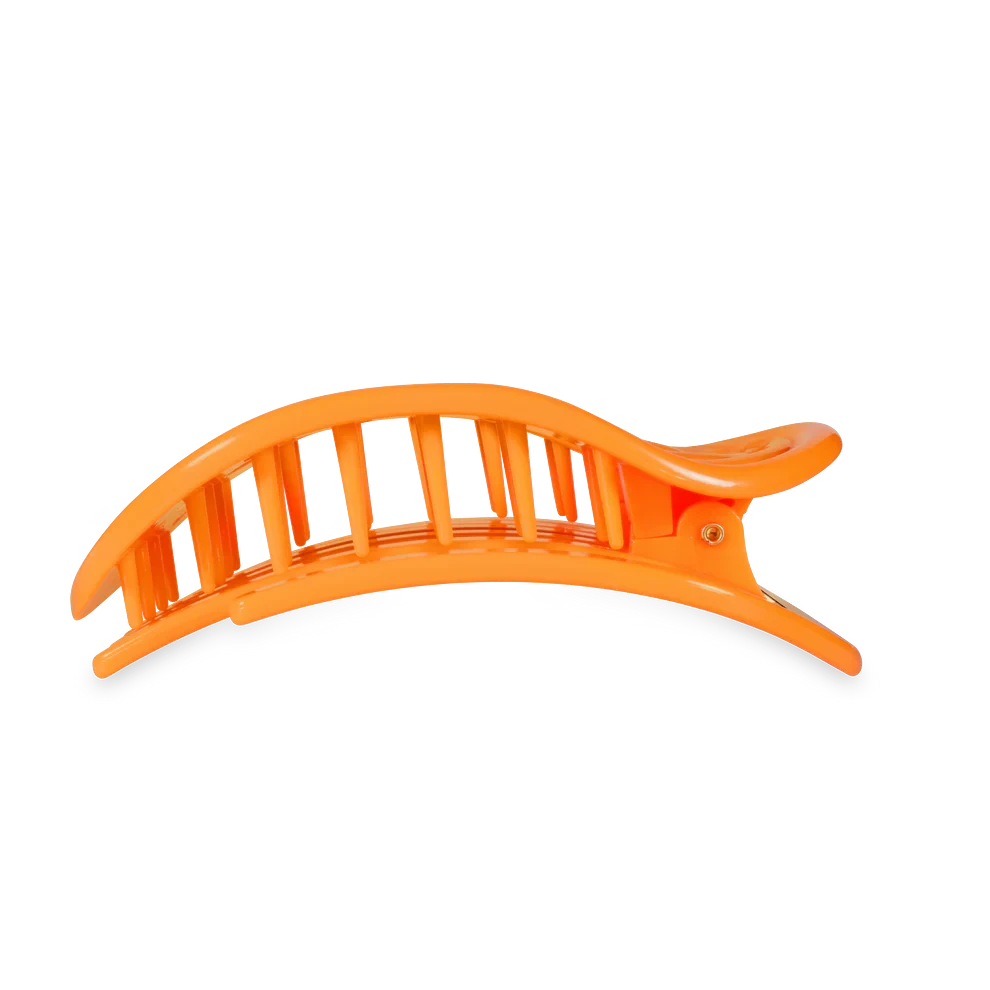 Doodlations Coffee Bar & Boutique orange flat round hair clip for sectioning hair during styling or updos.