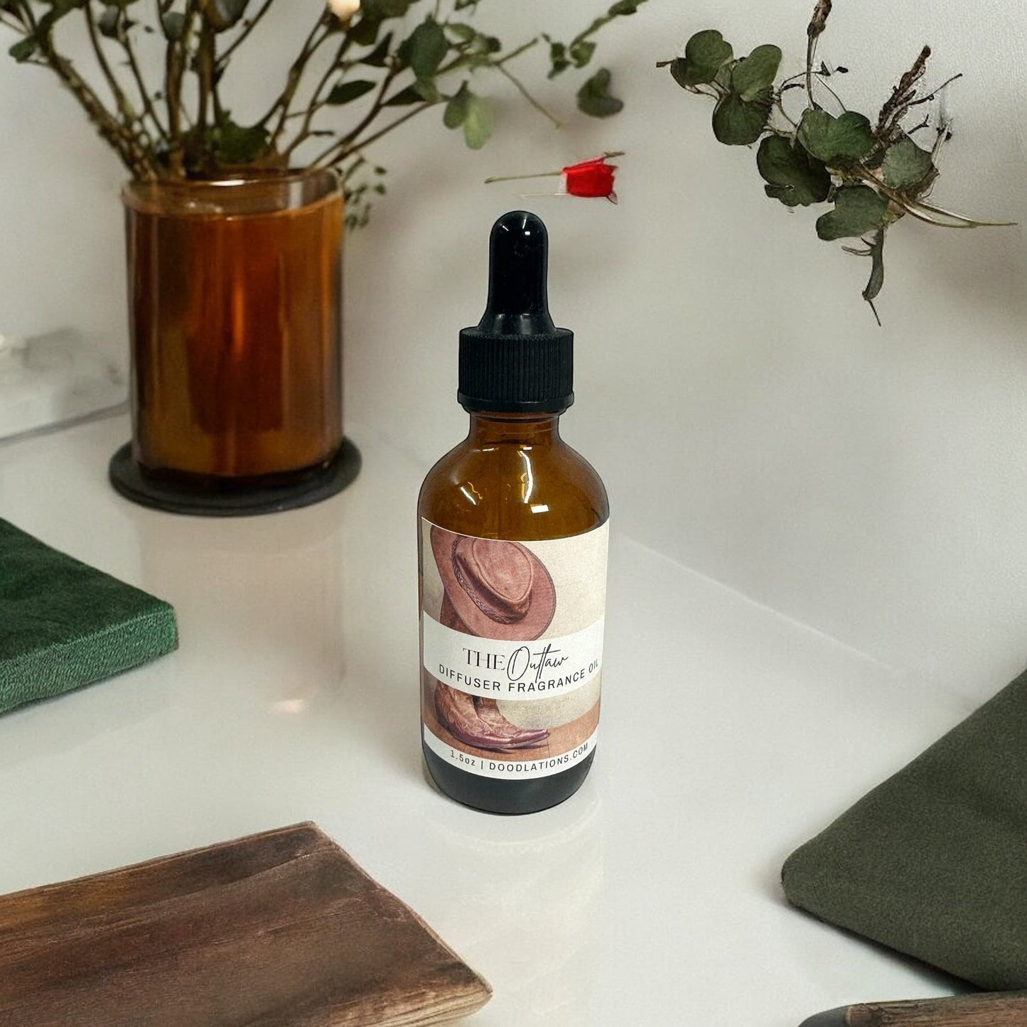 Doodlations Coffee Bar & Boutique The Outlaw fragrance oil in amber dropper bottle with cowboy hat graphic. 1.6oz.
