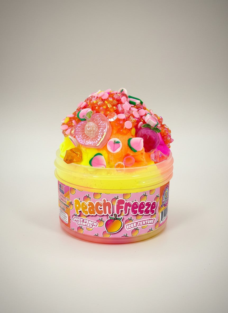 Doodlations Peach Freeze slime with swirled neon pink, orange, and yellow, topped with peach charms, sprinkles, and icee texture.