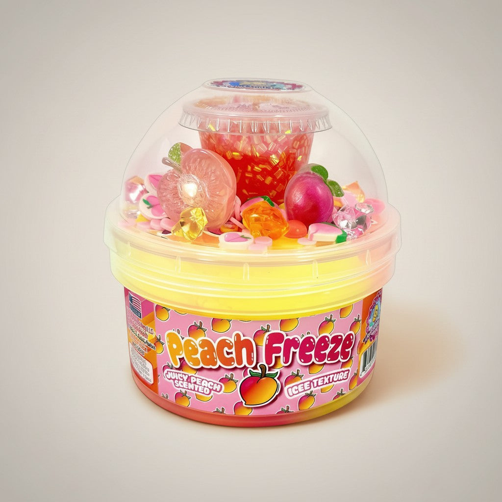 Doodlations Peach Freeze slime in a clear dome container, swirled pink, orange, and yellow with peach charms and sprinkles.