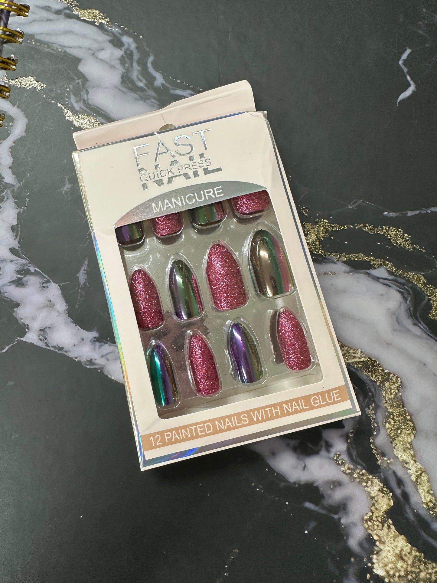 Doodlations Coffee Bar & Boutique Fast Nails Quick Press Manicure set with 12 pink glitter and iridescent chrome almond-shaped press-on nails.