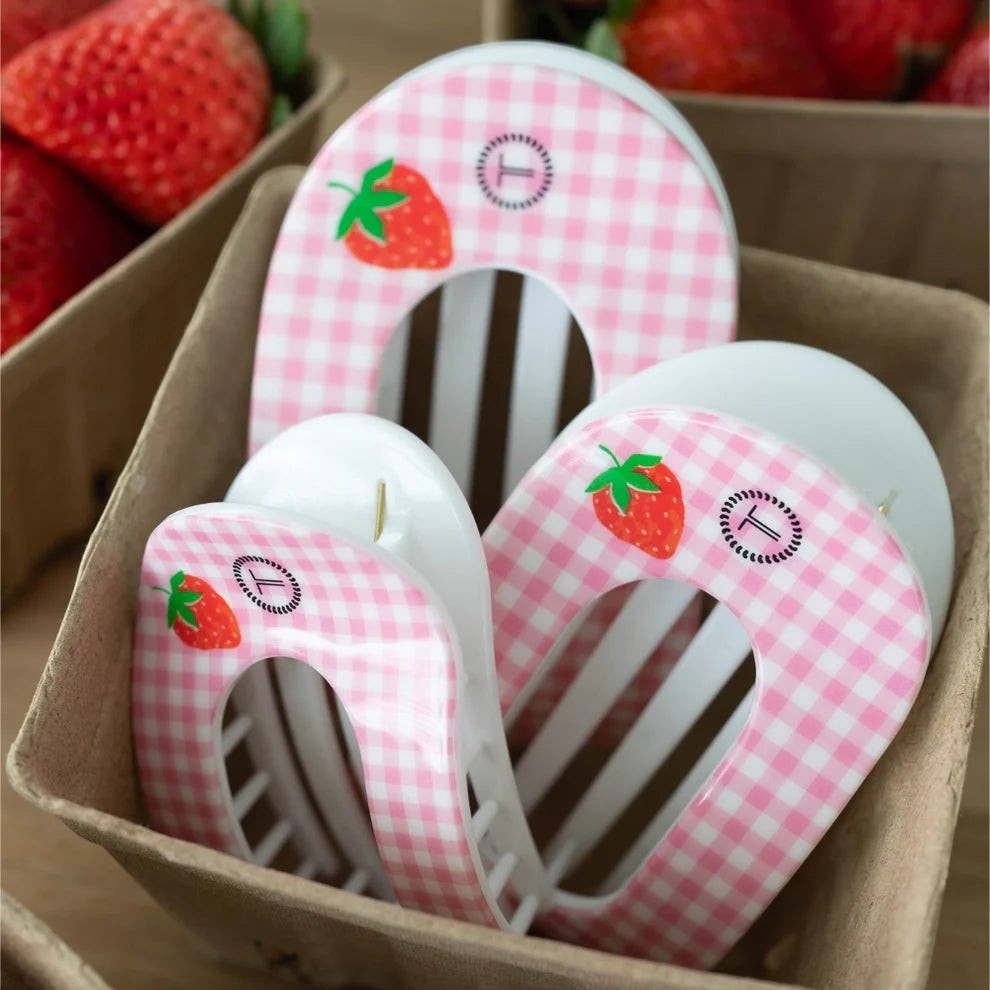 Doodlations pink gingham hair clip with strawberry accent, flat round design.