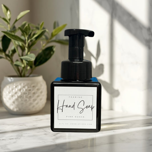 Doodlations Coffee Bar & Boutique pink guava foaming hand soap in a black square bottle with a black pump dispenser.