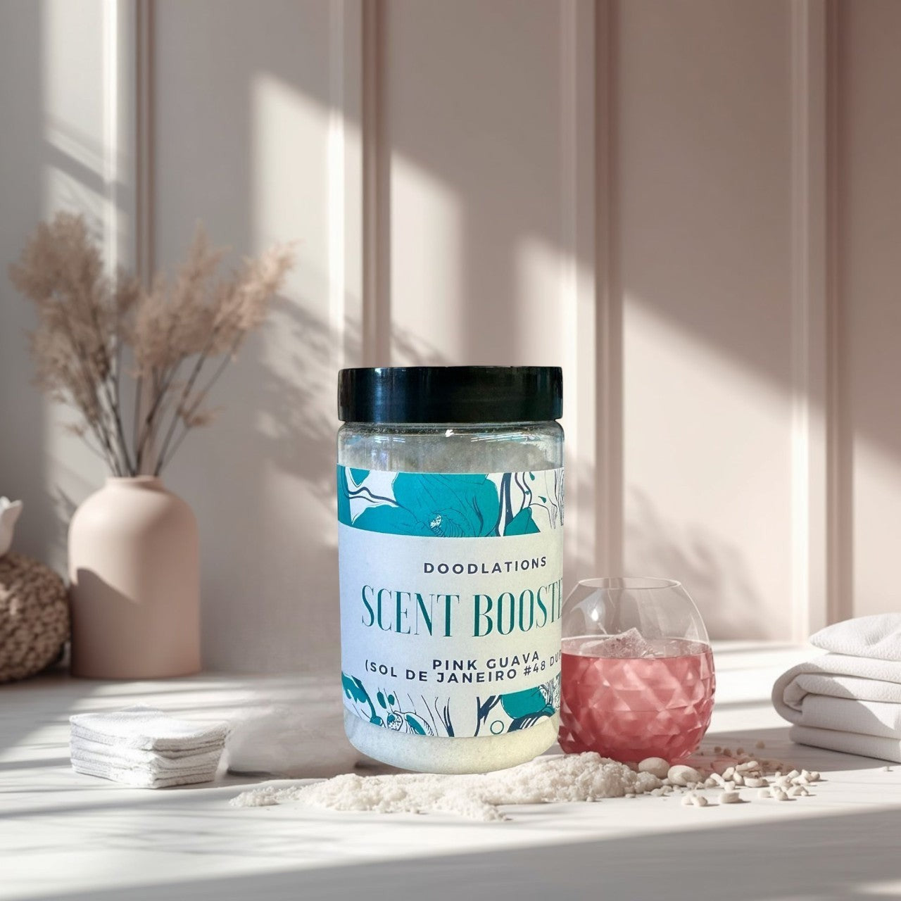 Doodlations Pink Guava laundry scent booster in a clear jar with a black lid. Tropical floral design.