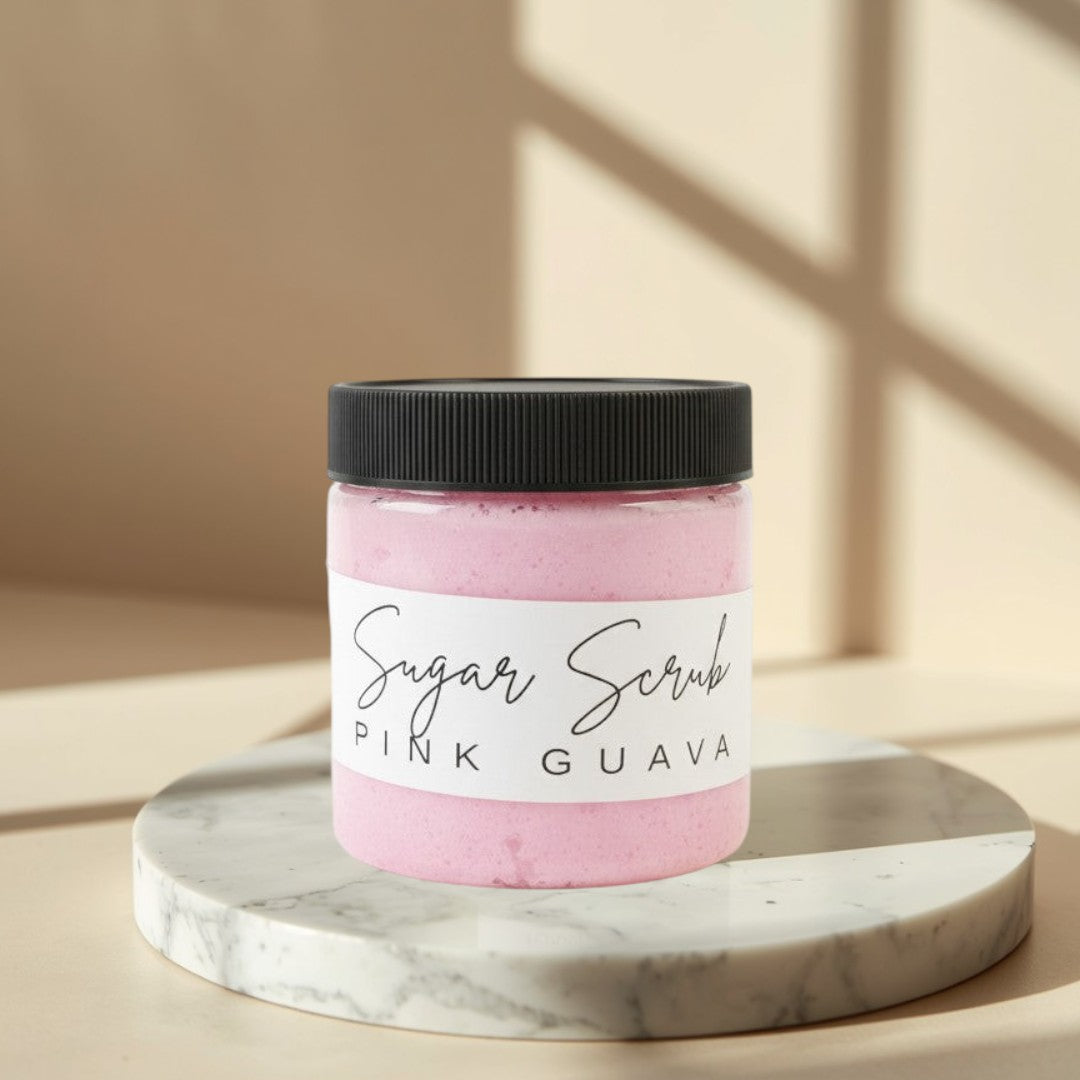 Doodlations Coffee Bar & Boutique Pink Guava Sugar Scrub in a clear jar with a black lid. Whipped pink scrub with visible texture.