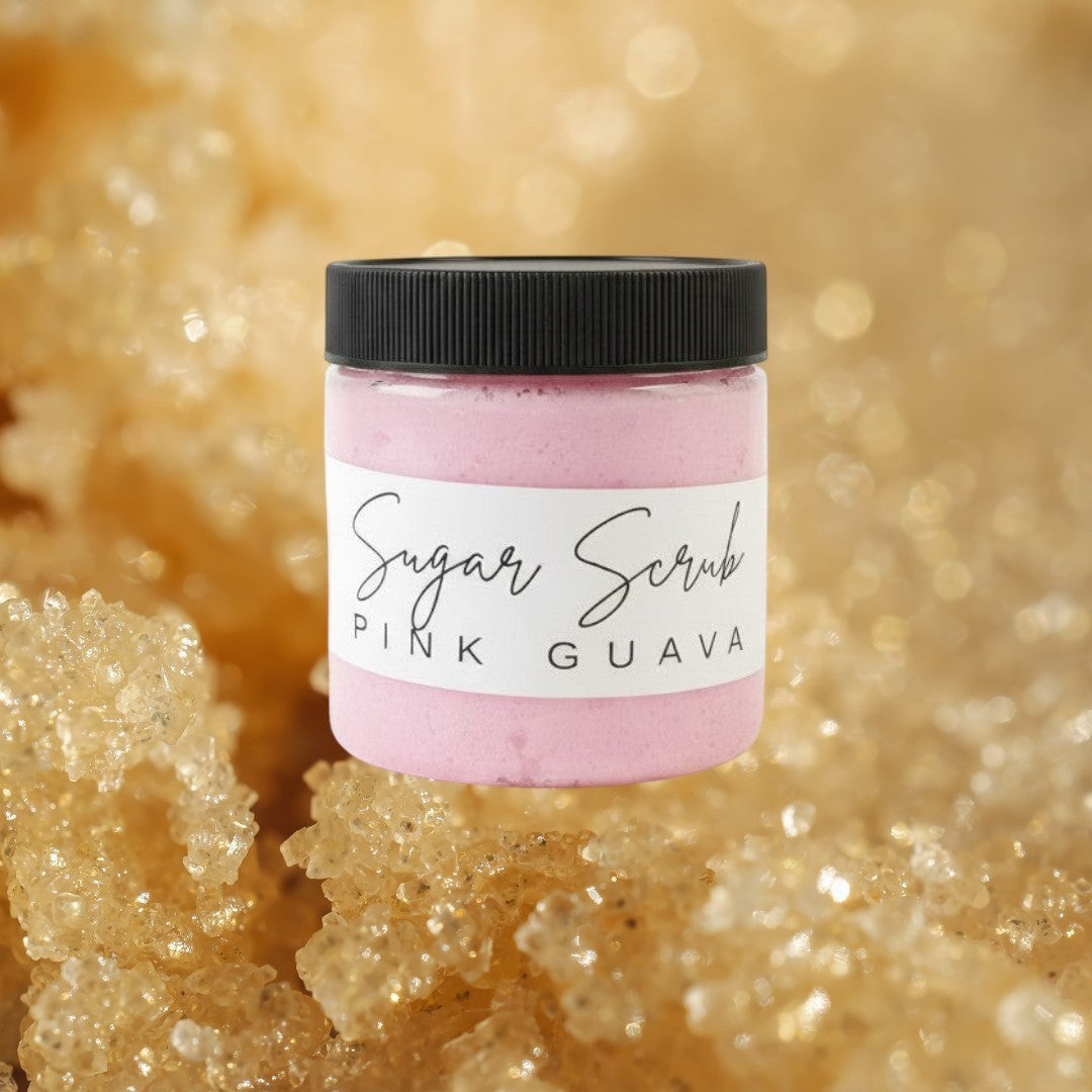 Doodlations Coffee Bar & Boutique Pink Guava Sugar Scrub in a clear jar with a black lid. Whipped pink scrub with grape seed oil.