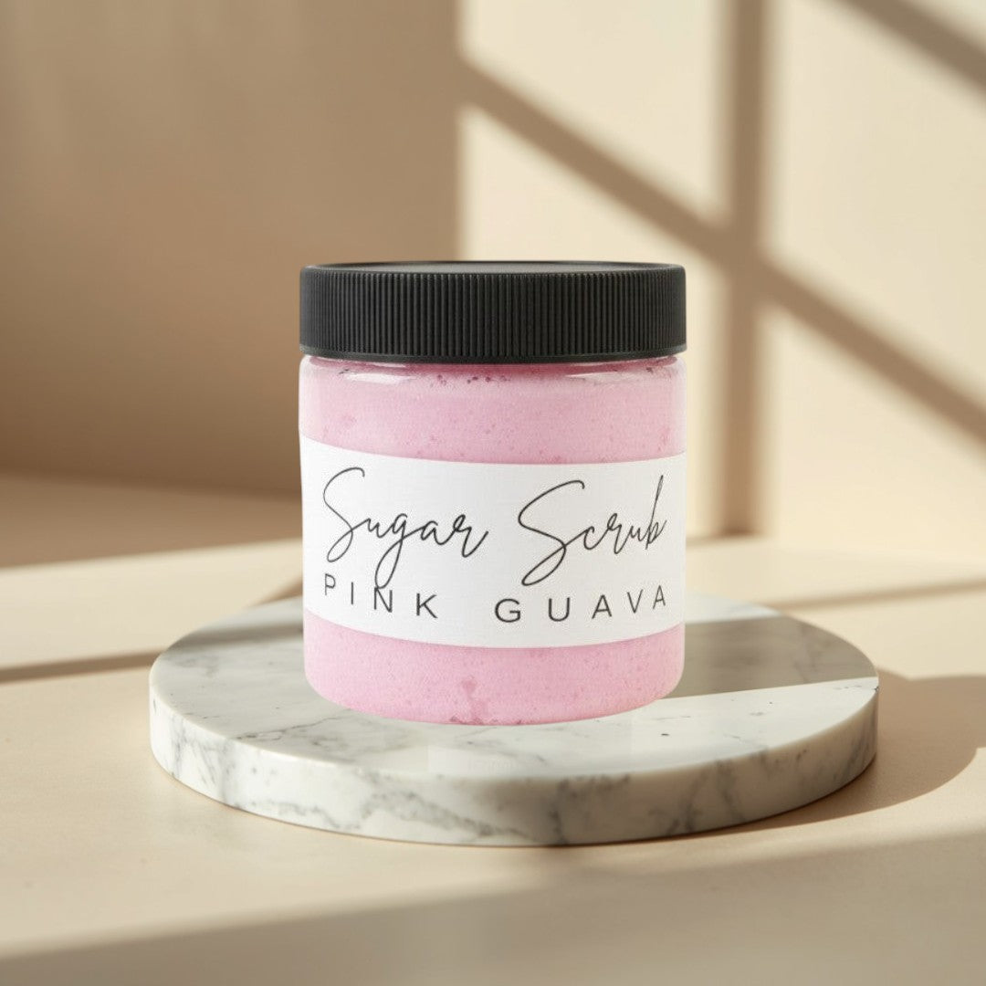 Doodlations Coffee Bar & Boutique Pink Guava Sugar Scrub in a clear jar with a black lid. Whipped pink scrub with visible texture.