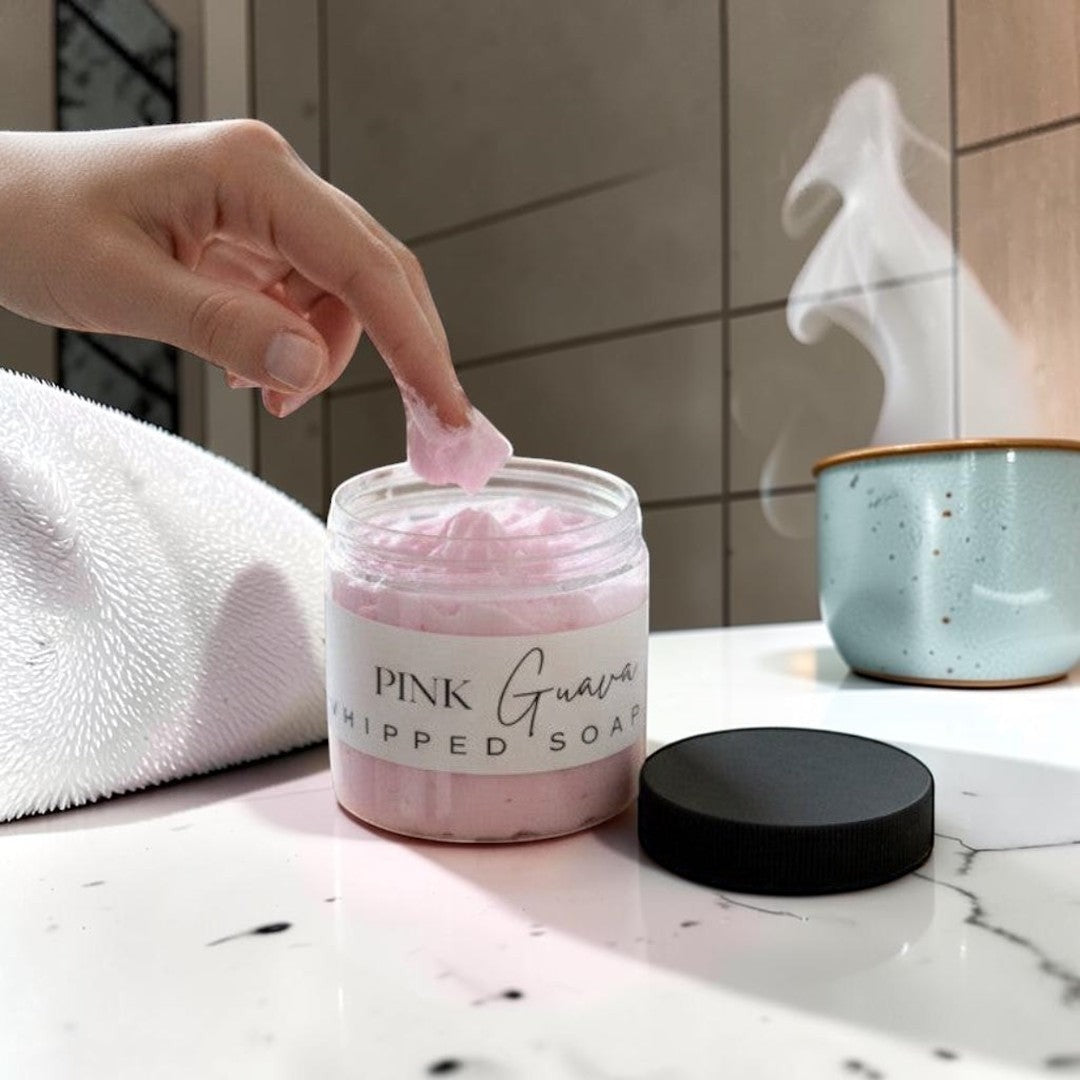 Doodlations Coffee Bar & Boutique Pink Guava Whipped Soap in a clear jar with a black lid. Light pink whipped soap with grape seed oil.