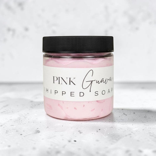 Doodlations Coffee Bar & Boutique Pink Guava Whipped Soap in a clear jar with a black lid. Light pink, fluffy soap with grape seed oil.