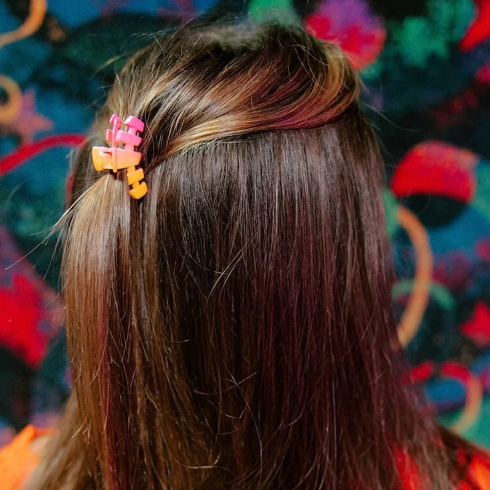 Doodlations Coffee Bar & Boutique pink and orange ombre segmented claw hair clip for secure styling.
