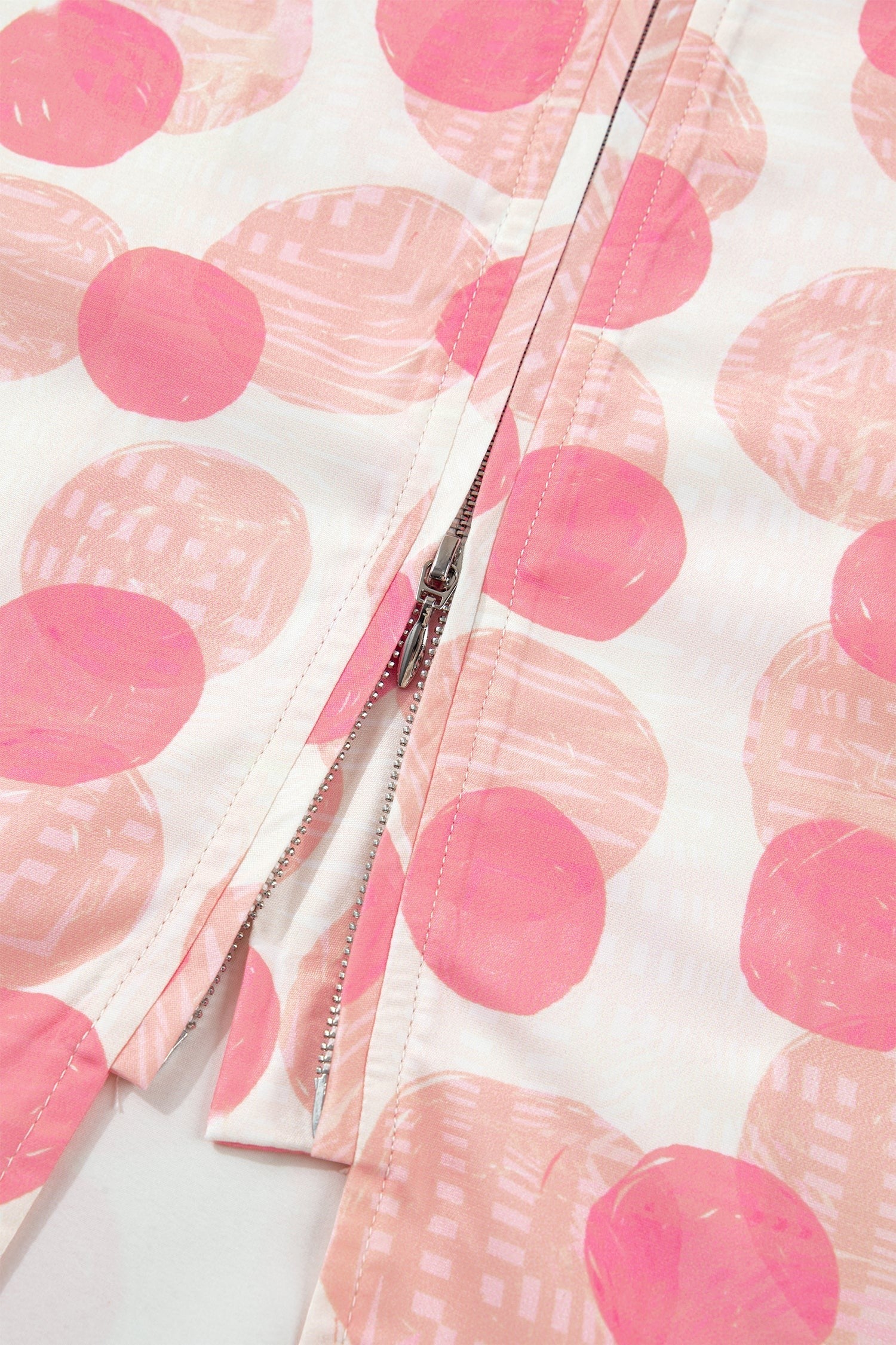 Doodlations Coffee Bar & Boutique pink and white polka dot midi dress with smocked waist and zip front.