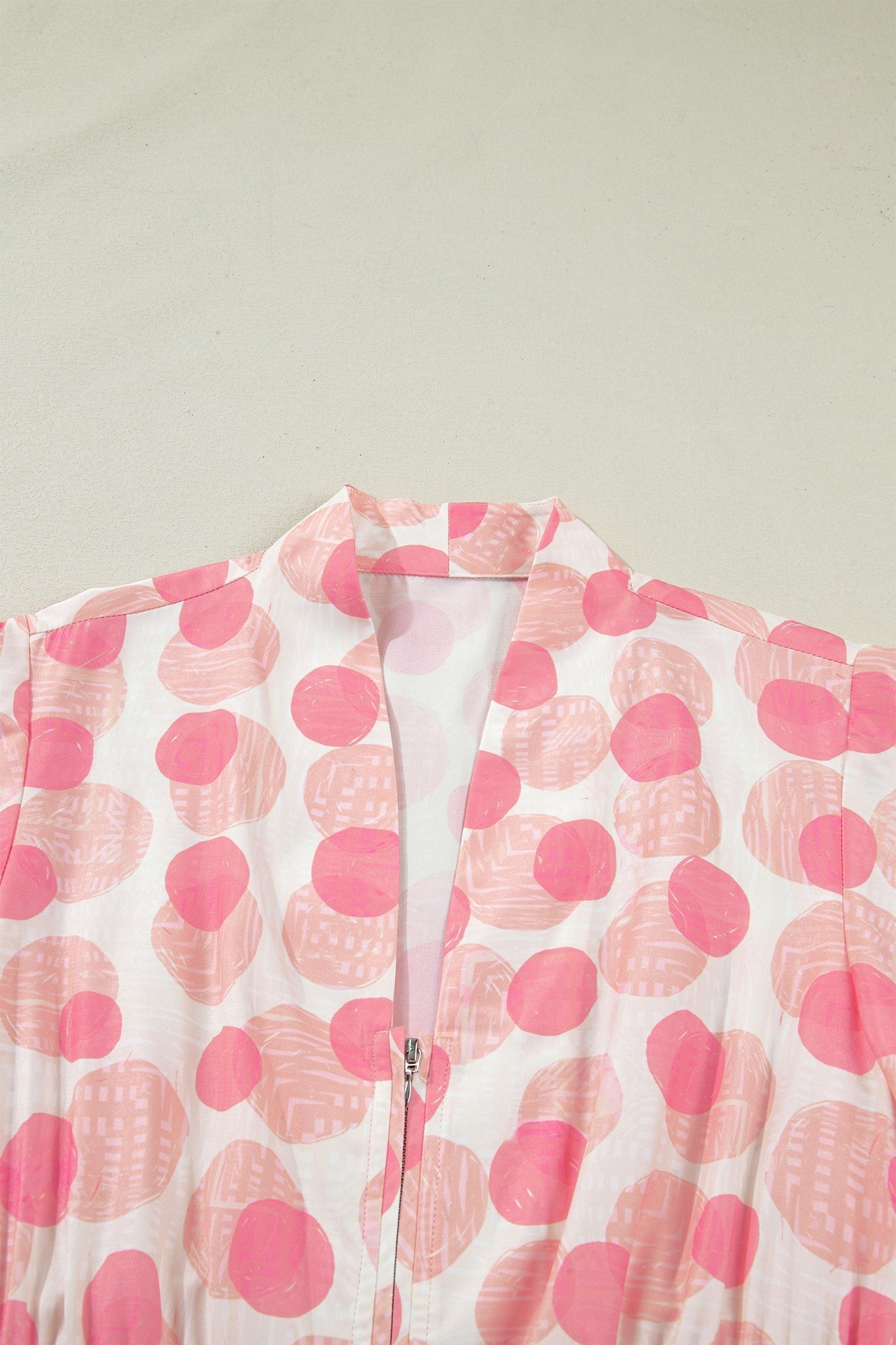 Doodlations Coffee Bar & Boutique pink and white polka dot midi dress with smocked waist and zip front.