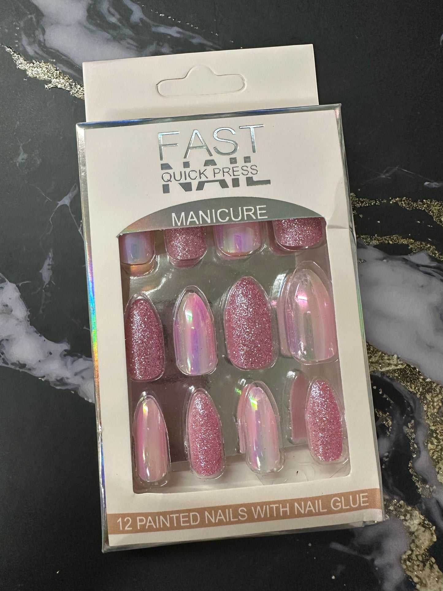 Doodlations Coffee Bar & Boutique Fast Nails Quick Press Manicure set with 12 pink glitter and iridescent chrome press-on nails.