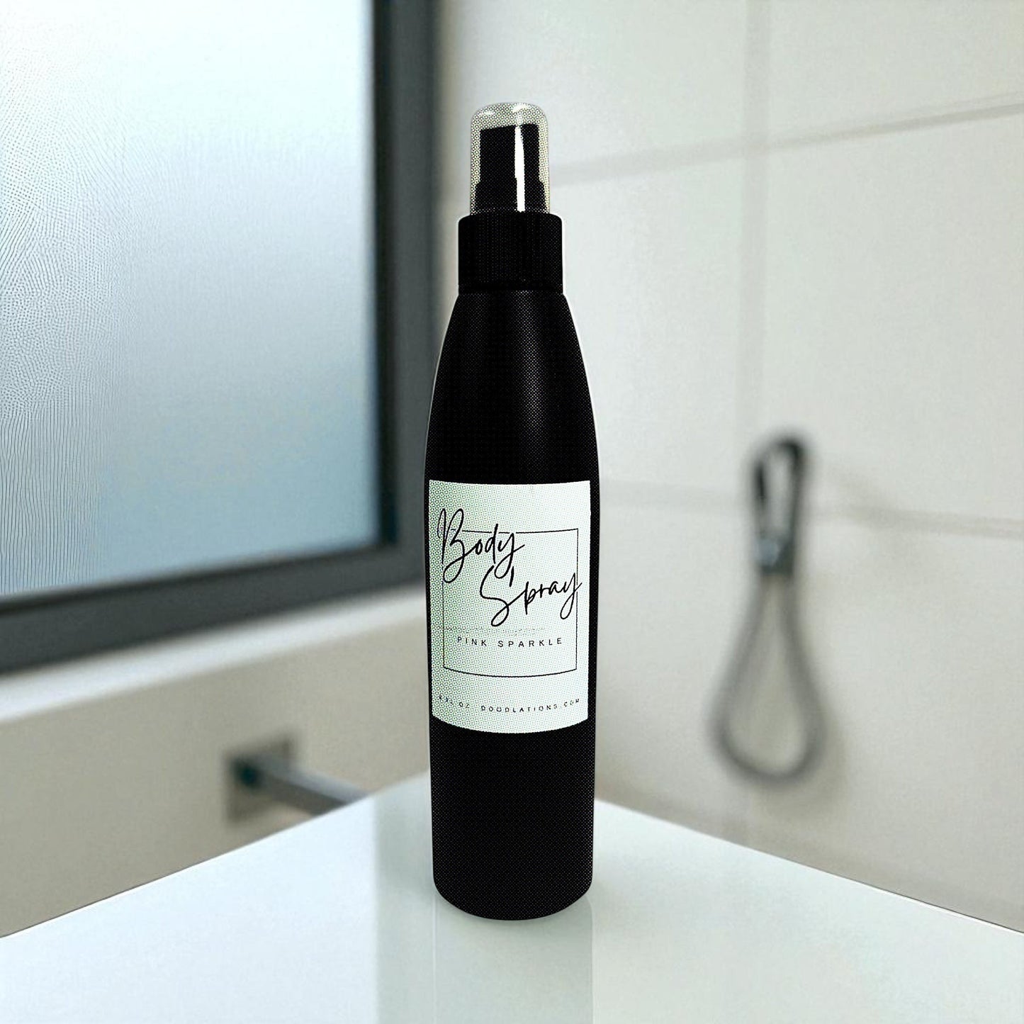 Doodlations Coffee Bar & Boutique Pink Sparkle moisturizing body spray in a black bottle with a white label.